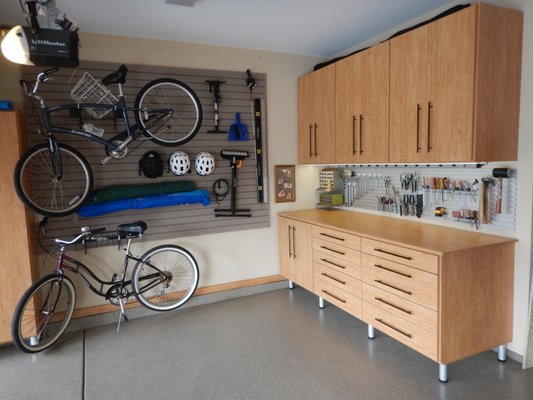 Custom garage workbencxh and wall storage for sports equipment.