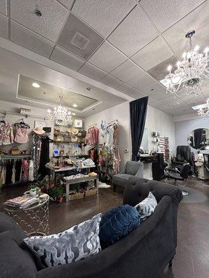 A boutique up front and cozy area to wait for your service or fill out paperwork.