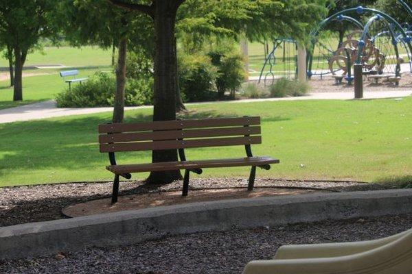 Park Bench In The Shade. Photo by Happy Tails Pet Pal, LLC.