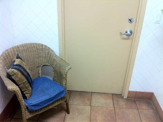 In case you want to have a convo while using the potty, ya know, there's a spare chair.