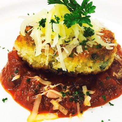 Pan Seared Polenta cakes with tomato sauce and grated Parmesan