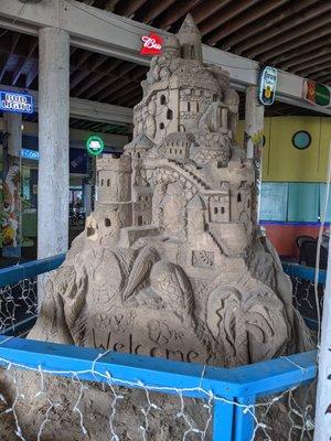 Cute sand castle at entrance