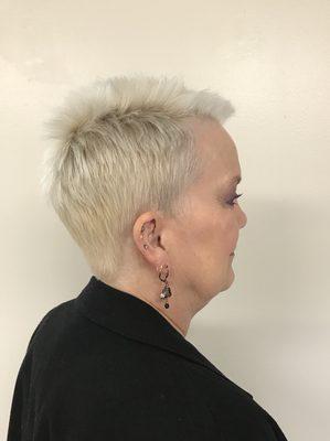 Platinum blonde, short razored pixie.