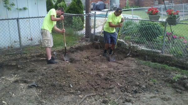 Prepping to set the base for our retaining wall