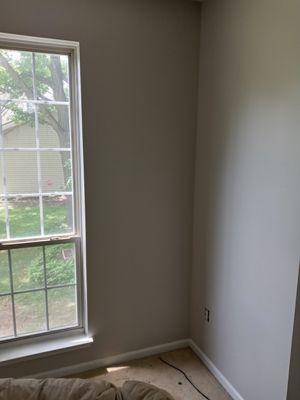 Before burgundy accent wall after Gray duration by Sherwin-Williams with enamel white trim Plus revamped fireplace.