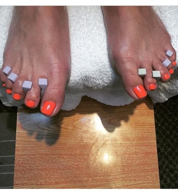 The.pedi service, with bright coral-ready for summer!