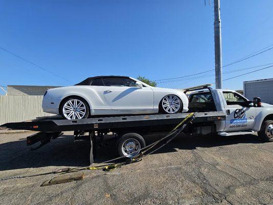 Exotic car towing with airbags malfunctioning.