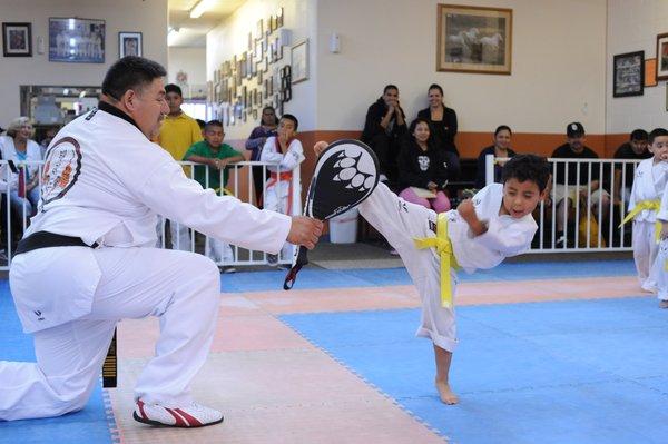 Grand Master Ramirez with young student.