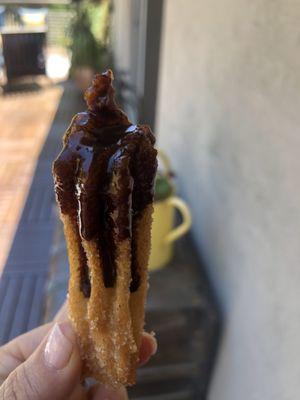 Churro with chocolate sauce