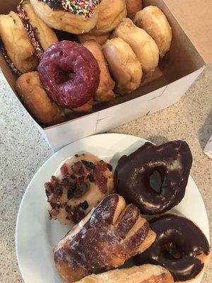 Maple Bacon, Chocolate Glazed, Bear Claw, Red Velvet, and a variety.