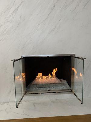 Wood fireplace converted to gas burner with fyre glass and new doors