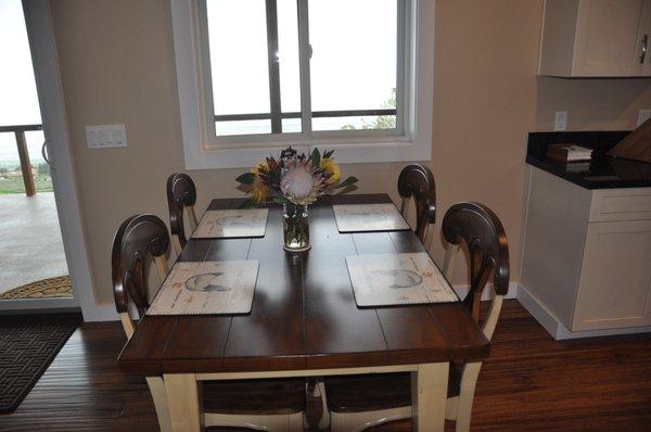 Dining table with fresh protea flowers from property.