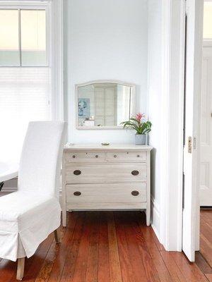 Quaint bedroom with an amazing shower.