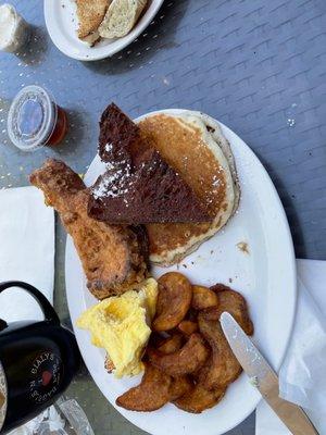 Gigantic plate of French Toast Pancakes egg and country fries