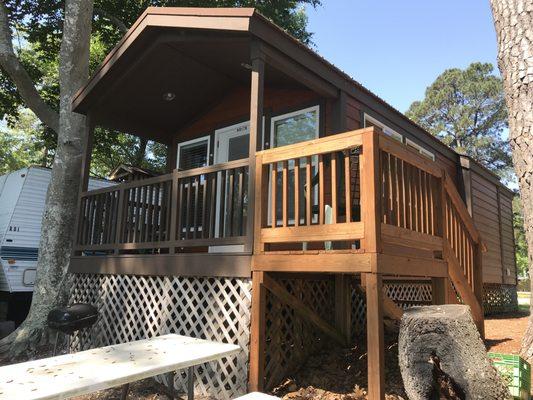 Deluxe cabin with porch over the river.