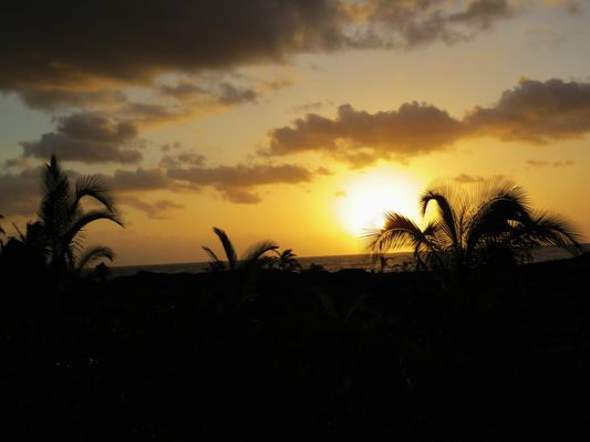 Sunrise in front of the Oceanfront Bali Hut.