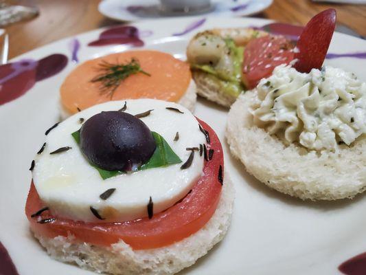 Tea sandwiches - angle #4: salmon, shrimp with avocado & grapefruit, goat cheese with grape, caprese