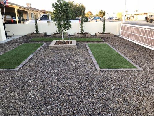 Artificial grass and rocks installed