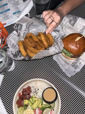 Burger, side of onion rings, poke bowl