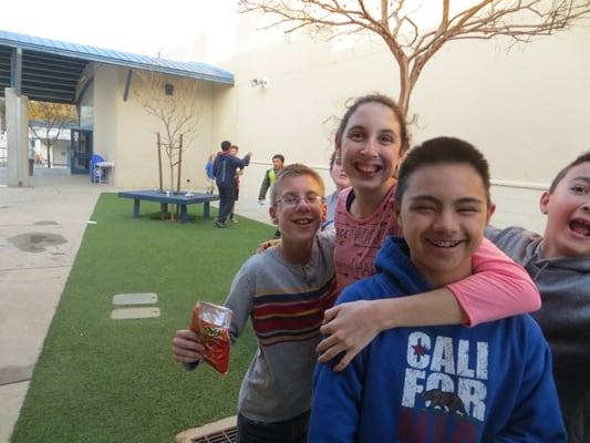 Friends hanging out on the front patio of the Boys & Girls Clubs.