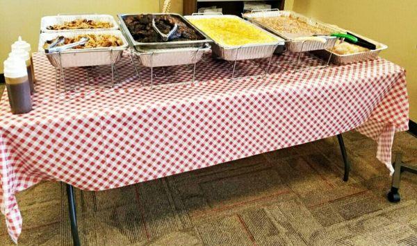 Smoke pulled pork and chicken with side of mac and cheese,  baked beans and rolls