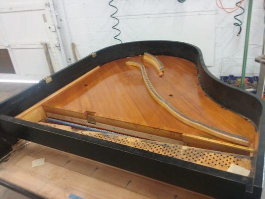 The original sounboard for this piano has been repaired and refinishe.