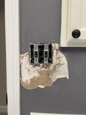 Bathroom drywall needing repairs.