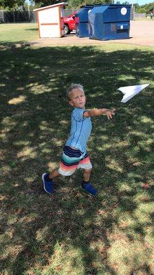 Curbside Outdoor PowerPhysEd!  We made our own paper airplane and flew them all around the park!  Great cardio and throwing skills!