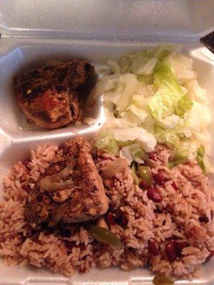 The jerk chicken has a kick, w/ red beans, rice, and cabbage