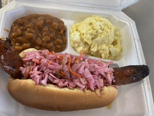 Badd Newz BBQ polish sausage plate with potato salad and baked beans