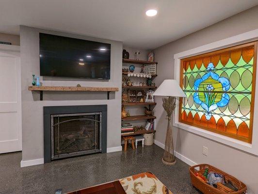 Gas fireplace installed  in venetian plastered wall with natural honed slated surround custom made at local slate quarry.