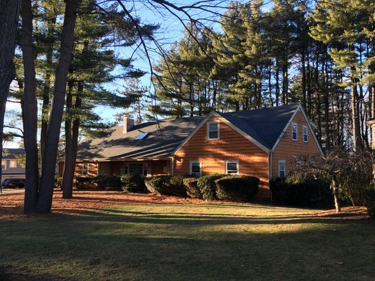 Sunset under the pines. This home is ready for winter.