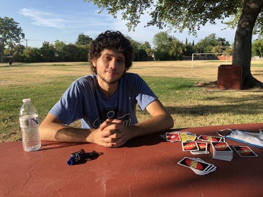 Uno cards, bottle water ,trees.