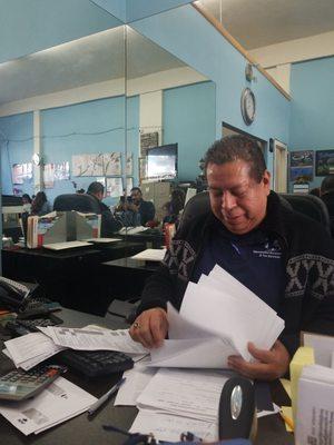 Mr. Hernandez handling so much paperwork and making it look easy while maintaining great poise and a smile.