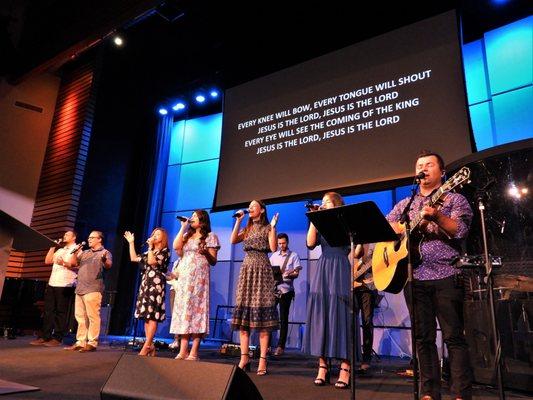 Sorin Bojin, one of Agape's Worship Team leaders, sings with the choir during a Sunday service.