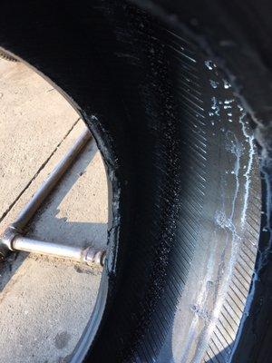 These are the type of "like new" tires they sell. Avoid this place!!