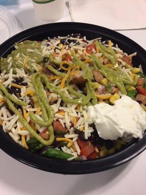 The generously sized Chicken Burrito Bowl has a variety of fresh ingredients including rice, beans, pico de gallo, cheese, and guacamole!