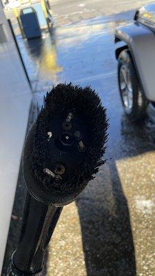 Tire cleaning brush with exposed sharp edges. Will damage your tire.