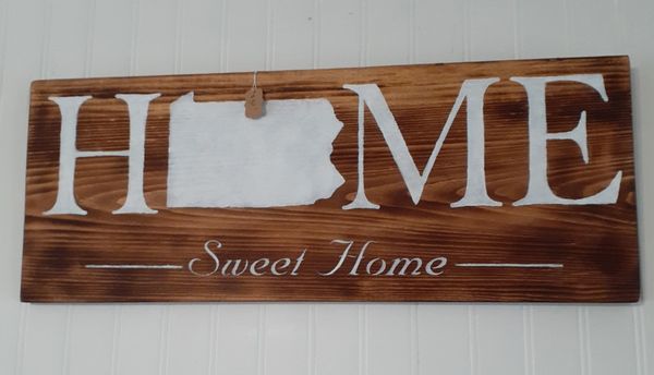 Wooden signs are made on site. 
Celebrate where you live.