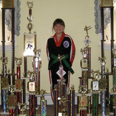 Student Displaying Her Trophy Collection