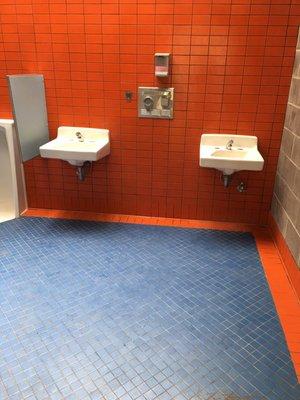 Clean cold water bathrooms in 70's blue and orange