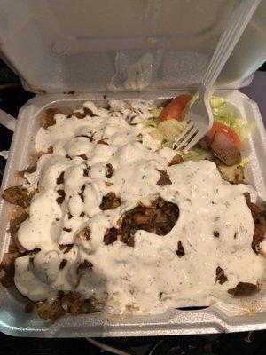 Chicken and lamb over rice with extra sauce.