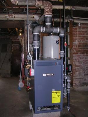 Weil McLaine Gas fired steam boiler with a Hydrolevel auto water feeder