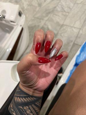 Stiletto shaped gel acrylics.