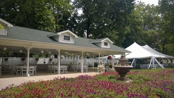 Wedding reception under the pavilion with a tent set up.