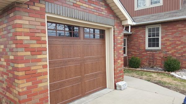 A New "wood look" garage door we installed. All the beauty of wood with the maintenance free characteristics of steel.