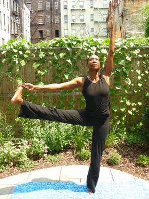 Founder, yoga instructor and coach, Vivian shows advanced poses.