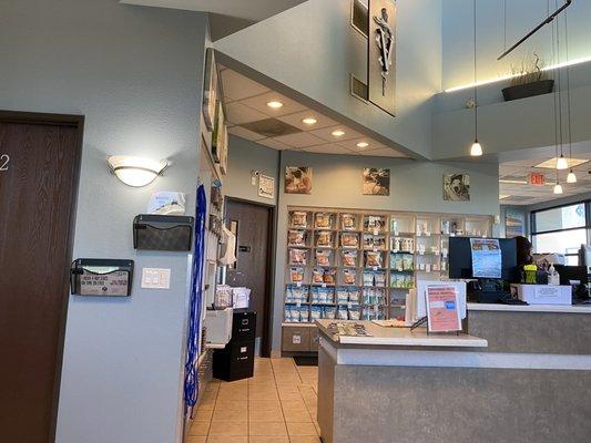 Lobby Reception desk with items for sale on shelf in back