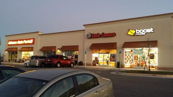 Store front at an angle & near by businesses