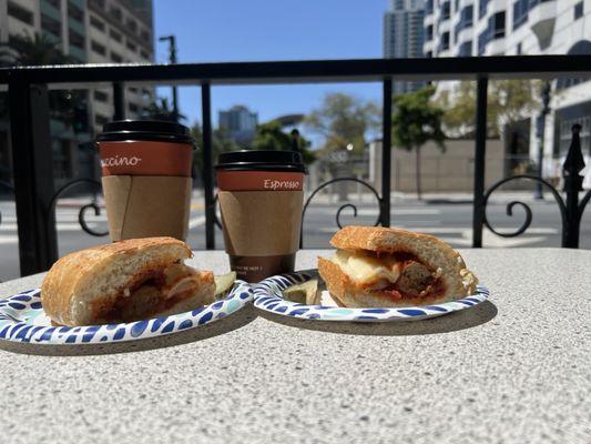 Meatball sandwhich with some coffee